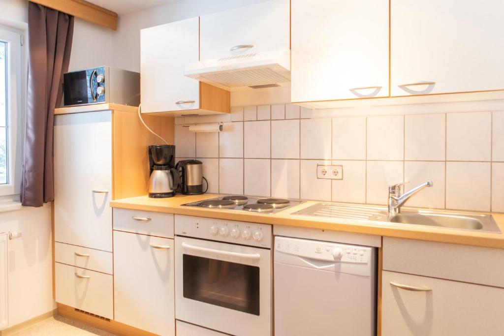 Kuchyň nebo kuchyňský kout v ubytování Sonnenhof - Apartments & Zimmer