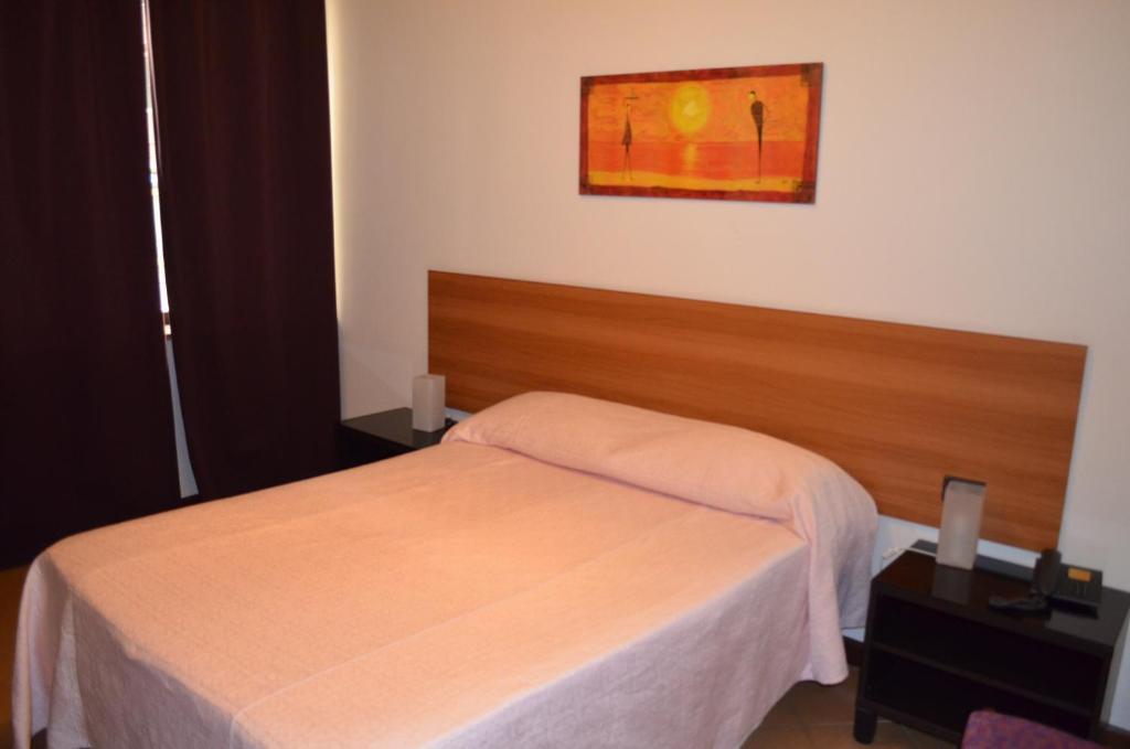 Postel nebo postele na pokoji v ubytování Hotel Adria