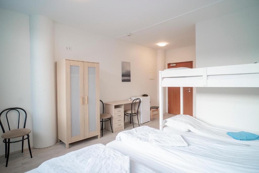 Rúm í herbergi á Guesthouse Pavi