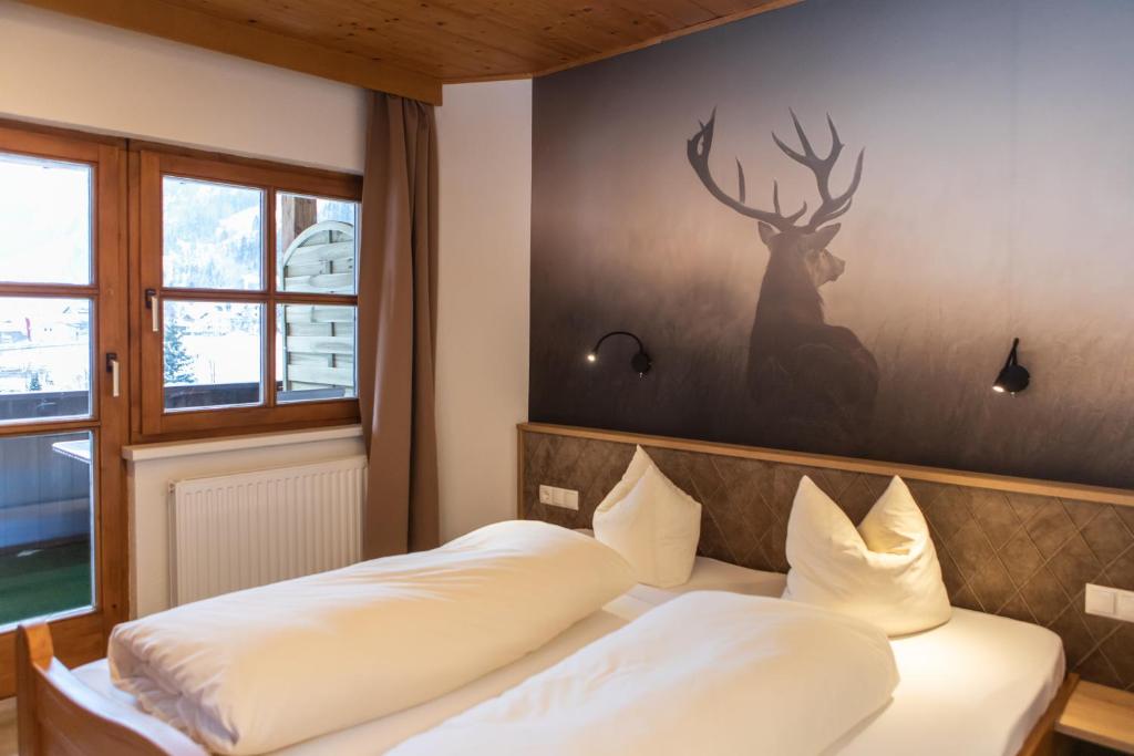 Postel nebo postele na pokoji v ubytování Sonnenhof - Apartments & Zimmer