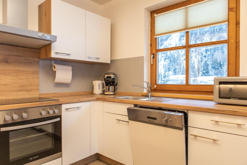 Kuchyň nebo kuchyňský kout v ubytování Sonnenhof - Apartments & Zimmer