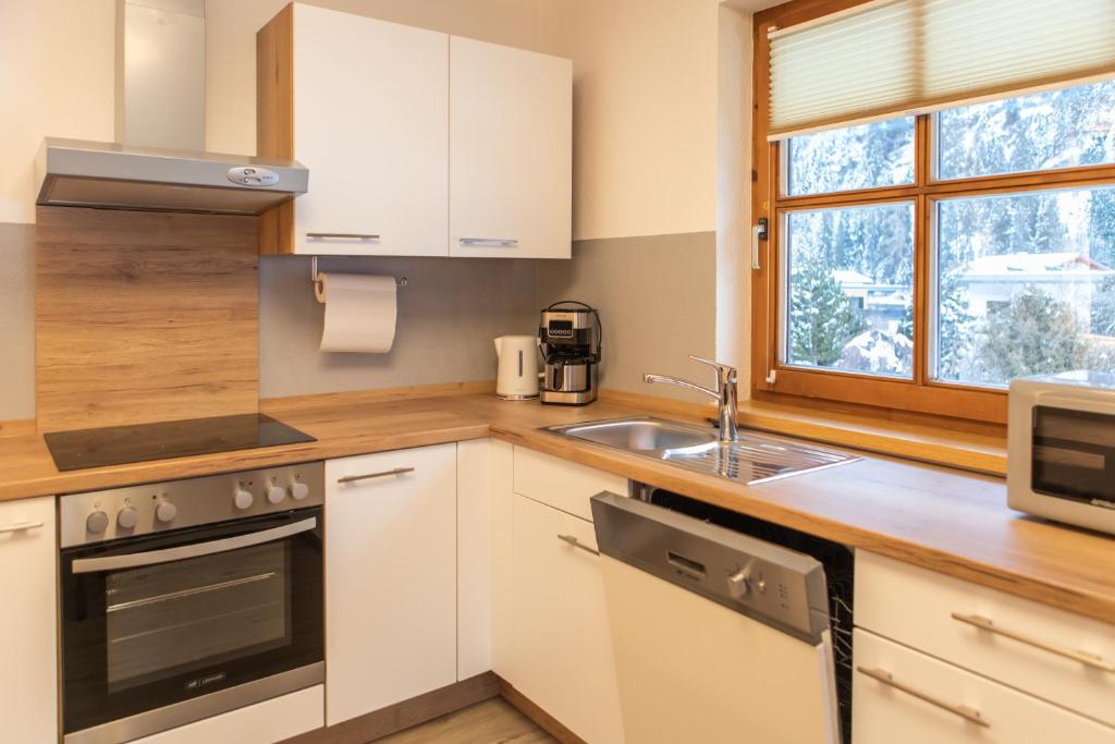 Kuchyň nebo kuchyňský kout v ubytování Sonnenhof - Apartments & Zimmer