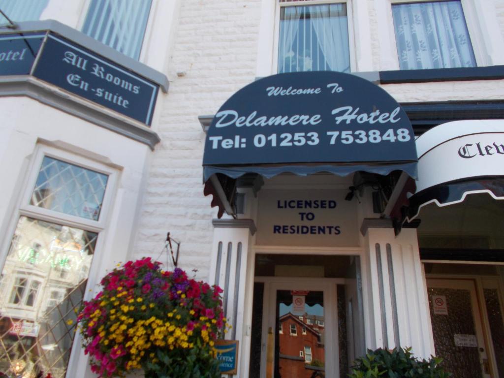 a building with signs on the front of it at Delamere Hotel in Blackpool