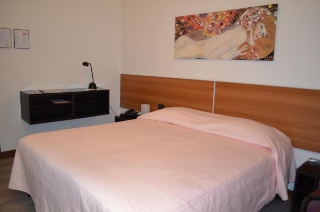 Postel nebo postele na pokoji v ubytování Hotel Adria