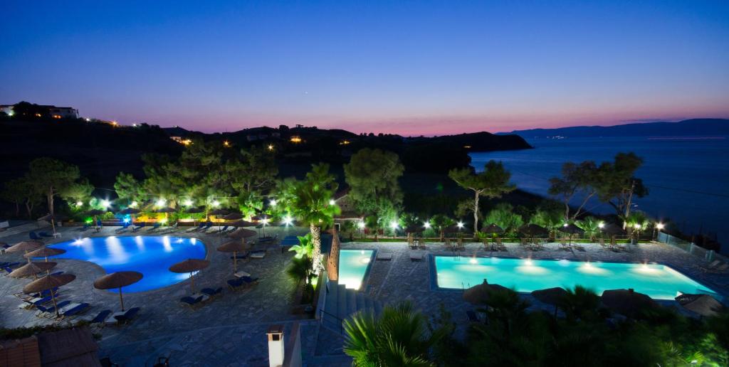 an aerial view of a resort pool at night at Viva Mare Hotel & Spa in Mythimna