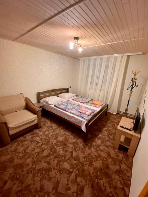 Postel nebo postele na pokoji v ubytování Pid Skeleyu