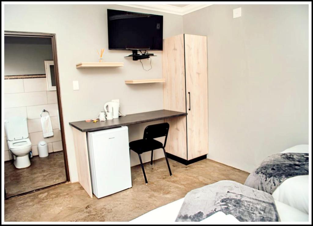 TV a/nebo společenská místnost v ubytování Madukwe Guesthouse