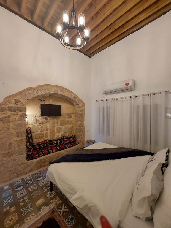 Postel nebo postele na pokoji v ubytování تاج عكا Taj Akko