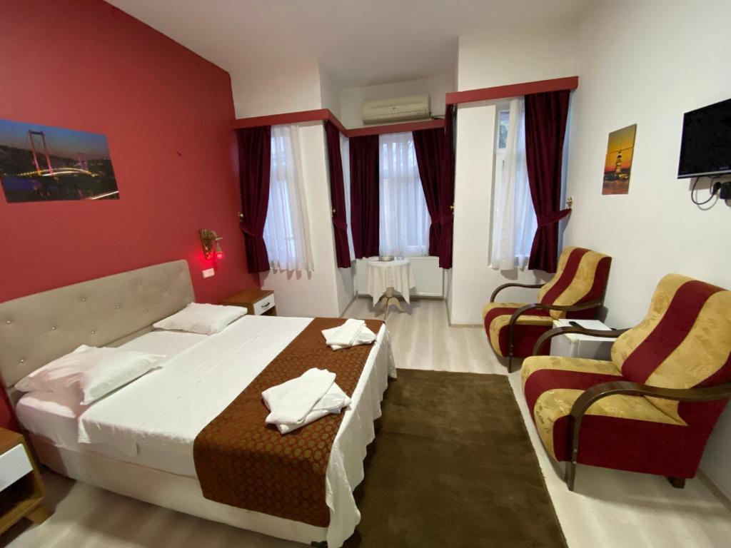 Postel nebo postele na pokoji v ubytování Masal Hotel