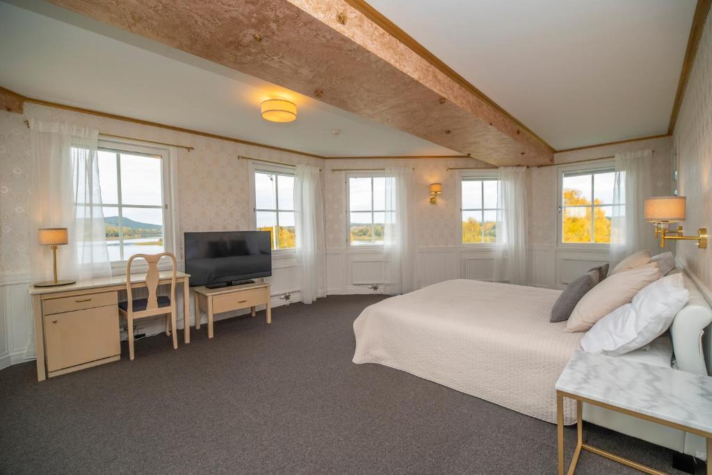 Postel nebo postele na pokoji v ubytování Grand Arctic Resort