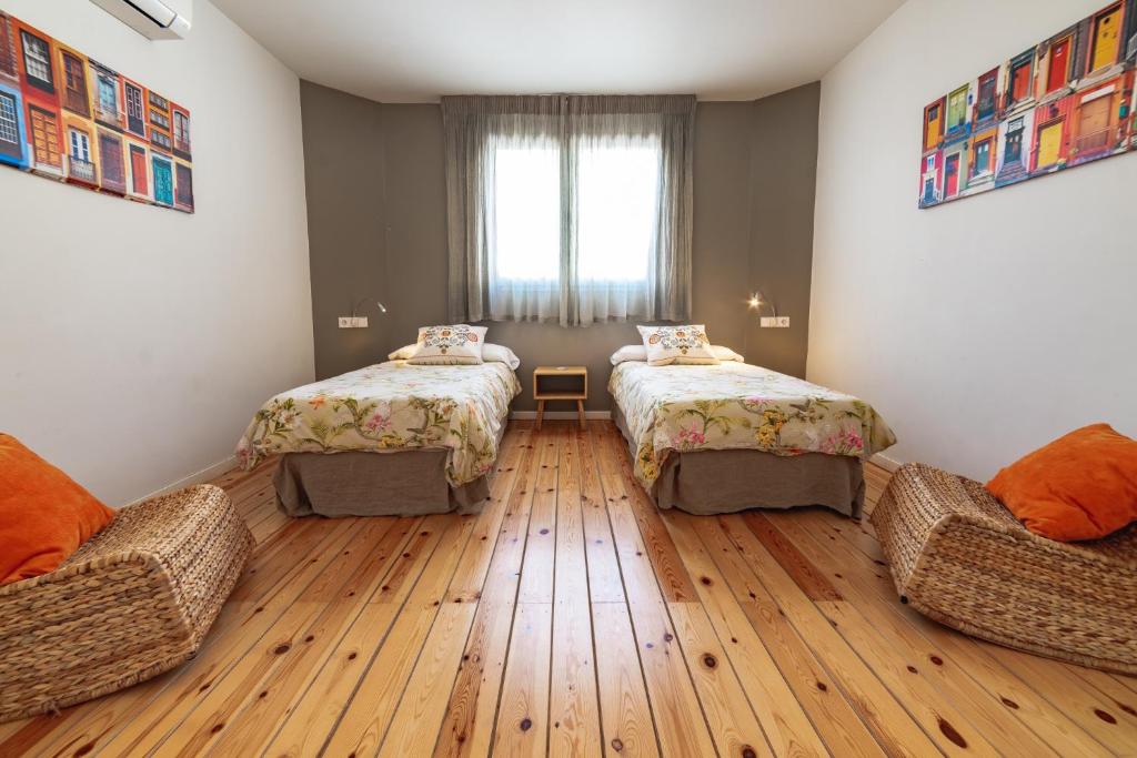 Postel nebo postele na pokoji v ubytování Apartamentos Alfonso X