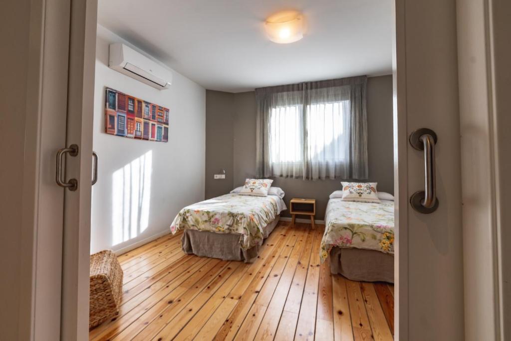 Postel nebo postele na pokoji v ubytování Apartamentos Alfonso X