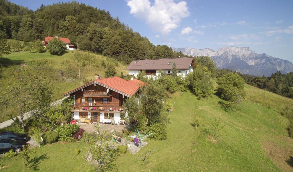 an aerial view of a house on a hill at Ferienwohnung im Lehnhäusl in Berchtesgaden