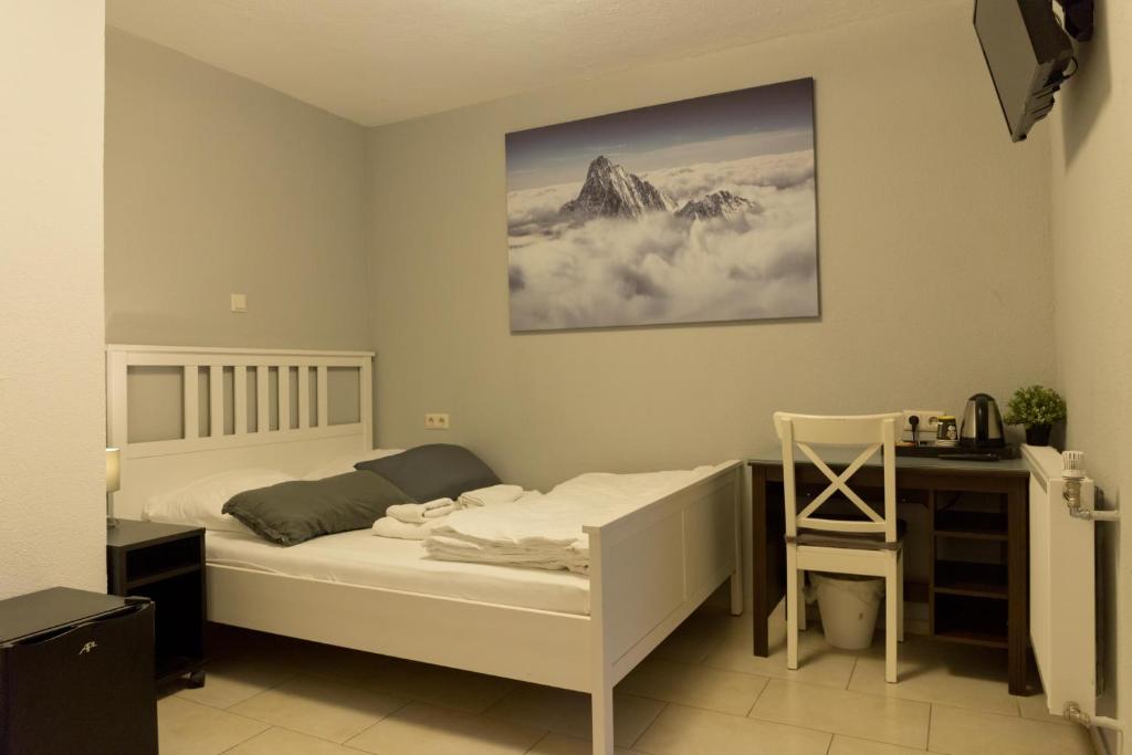 Ein Bett oder Betten in einem Zimmer der Unterkunft Hotel Frankenthaler Hof