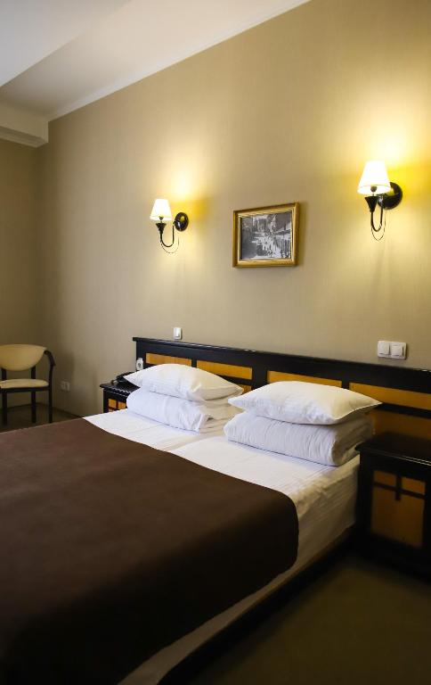 Postel nebo postele na pokoji v ubytování Georg Palace Hotel