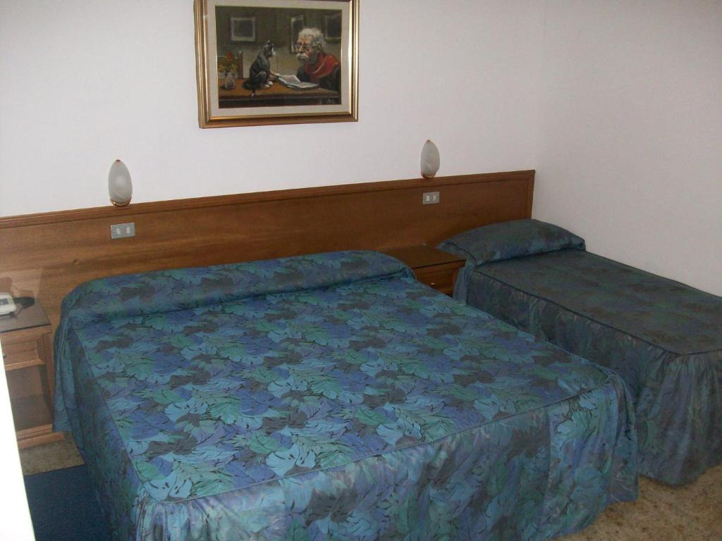 Postel nebo postele na pokoji v ubytování HOTEL SANTOROTTO di FABIO TERROSI