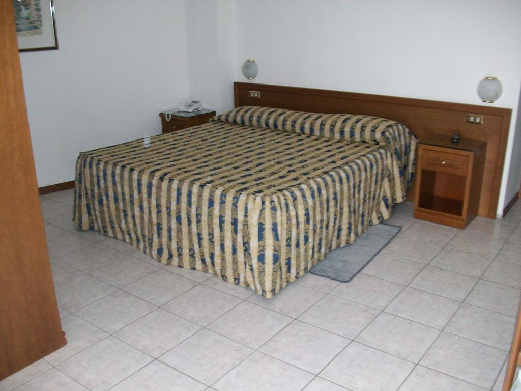 Postel nebo postele na pokoji v ubytování HOTEL SANTOROTTO di FABIO TERROSI