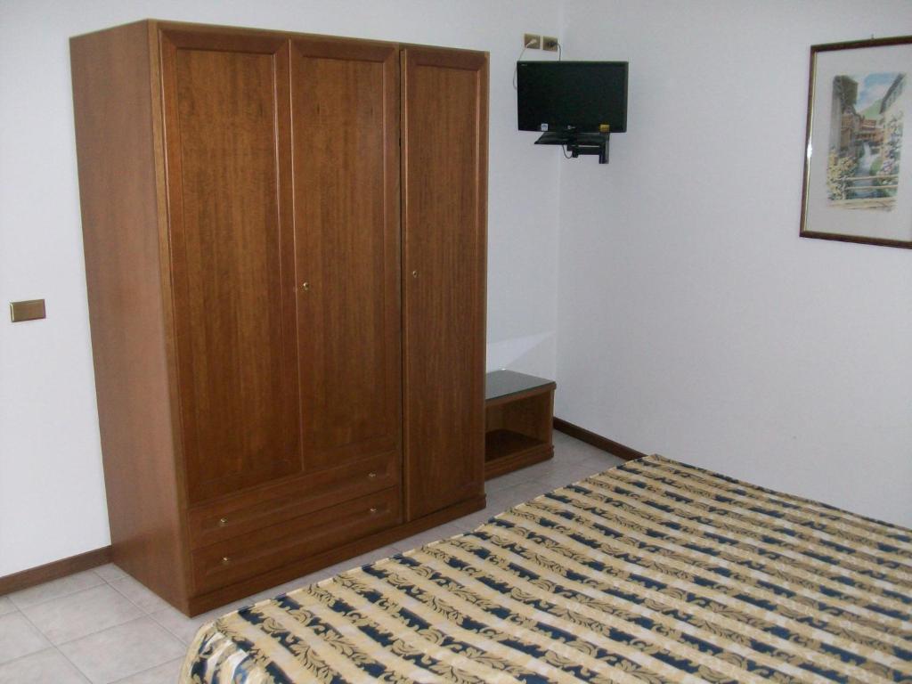 Postel nebo postele na pokoji v ubytování HOTEL SANTOROTTO di FABIO TERROSI