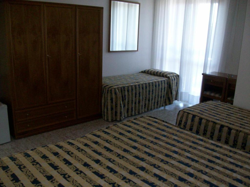 Postel nebo postele na pokoji v ubytování HOTEL SANTOROTTO di FABIO TERROSI