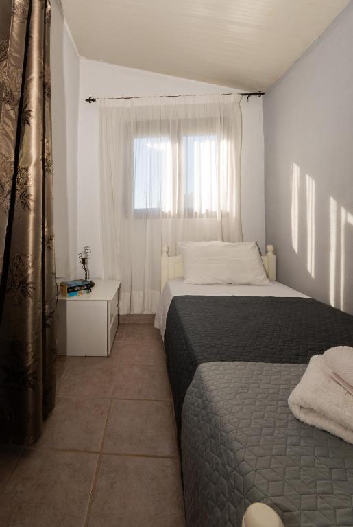 Postel nebo postele na pokoji v ubytování Serenity House