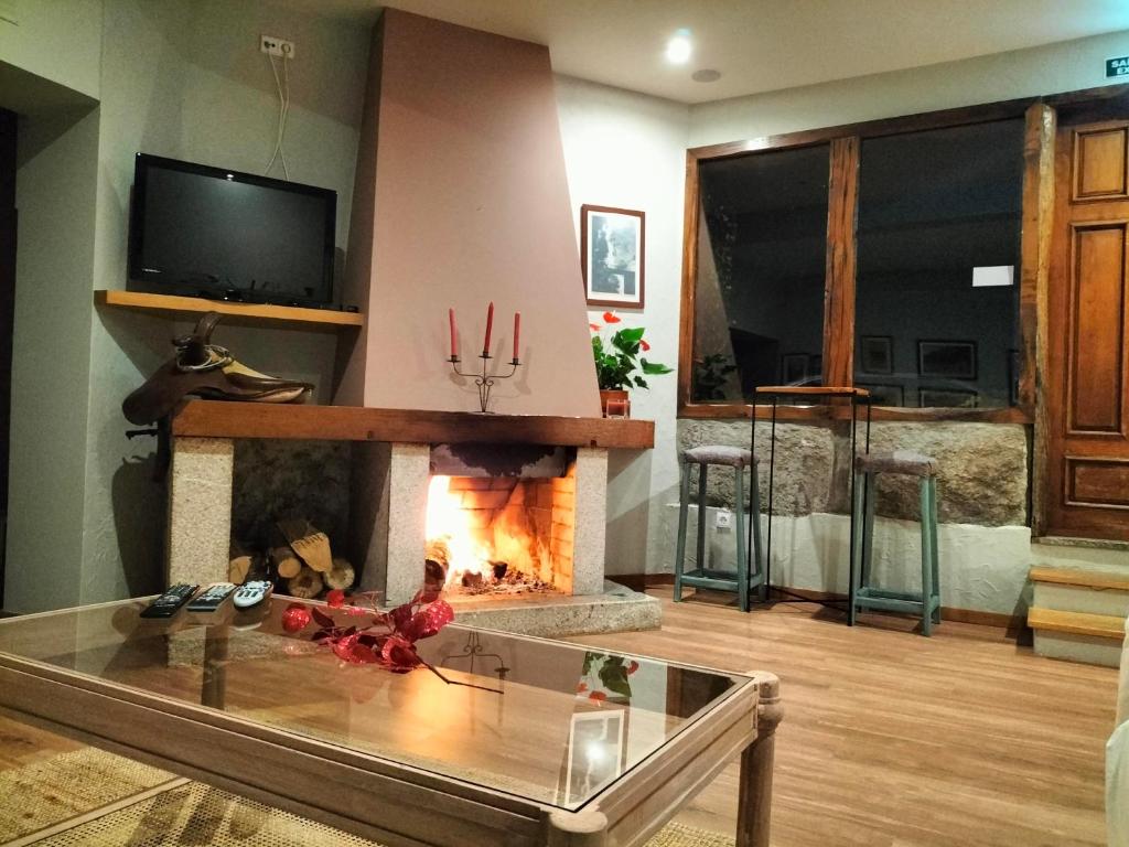 TV a/nebo společenská místnost v ubytování Hotel Carvalho Araujo
