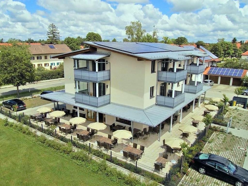 an aerial view of a house with solar panels on it at Hotel Heimfeld Restaurant Cafe in Garching an der Alz