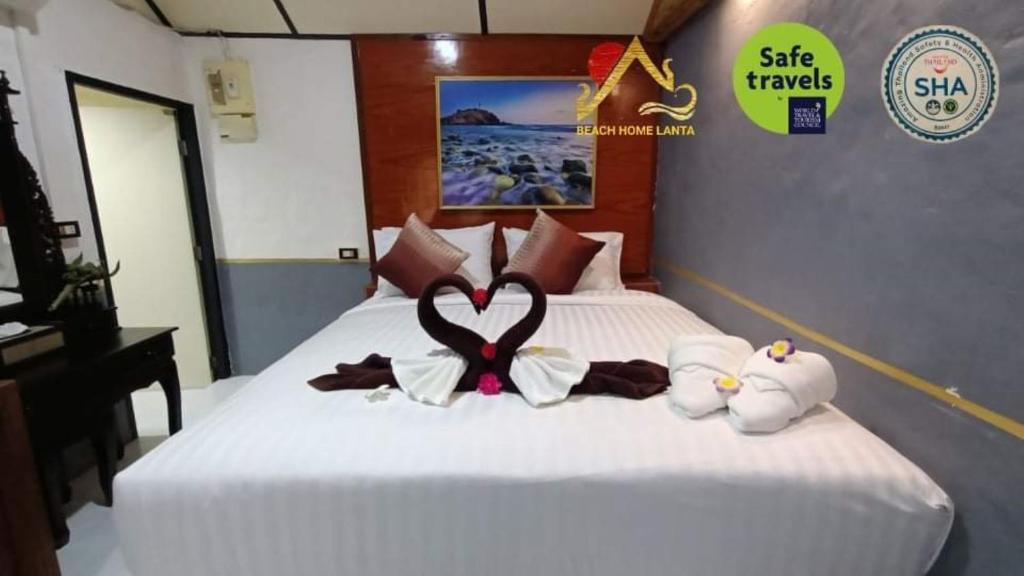 Postel nebo postele na pokoji v ubytování Beach Home Lanta