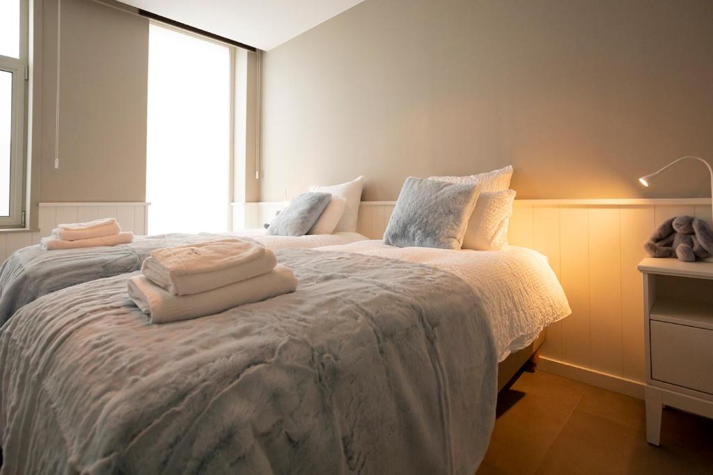 Postel nebo postele na pokoji v ubytování Enjoytoday vakantiewoning 45