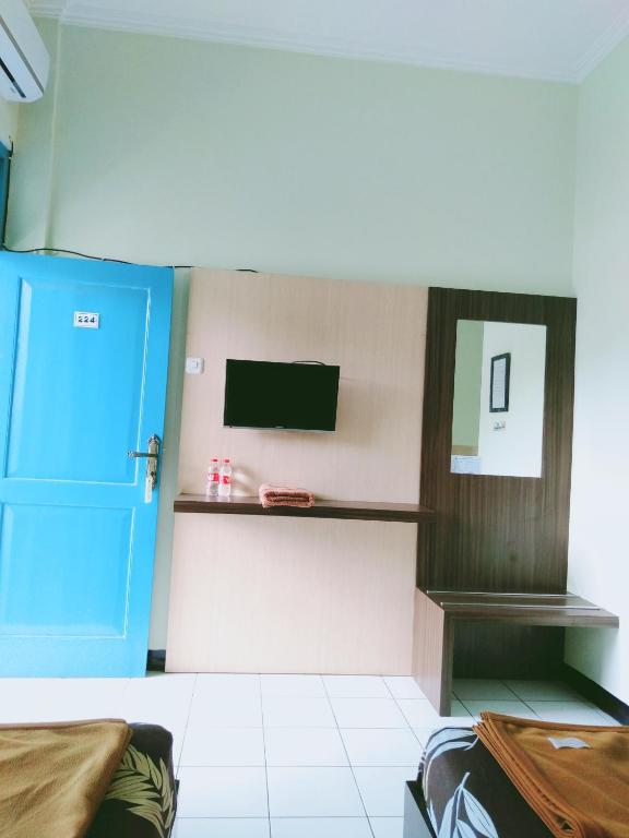 TV a/nebo společenská místnost v ubytování Hotel Taman Indah