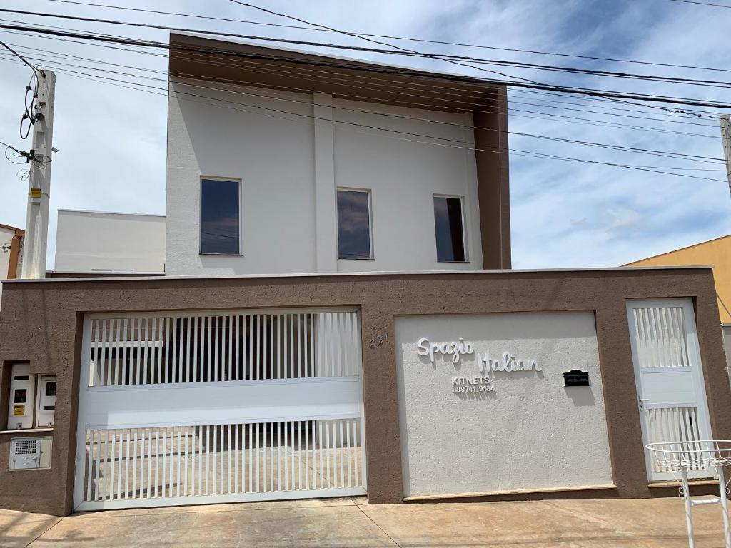 a building with two garage doors in front of it at Spazio Italian Lofts in Paulínia