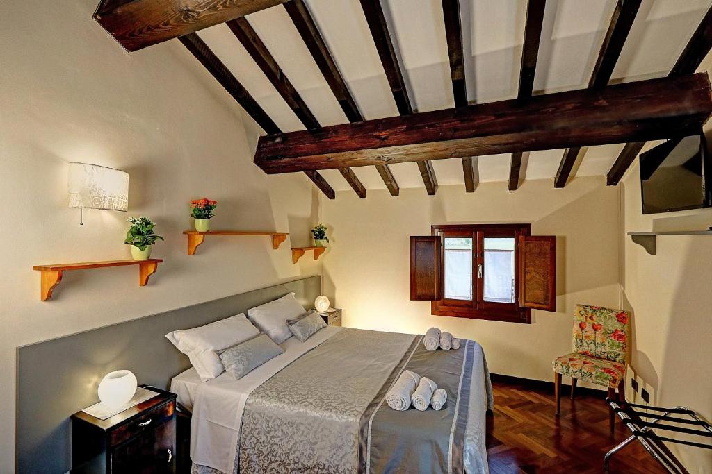 Postel nebo postele na pokoji v ubytování B&B Le Noci di Feo