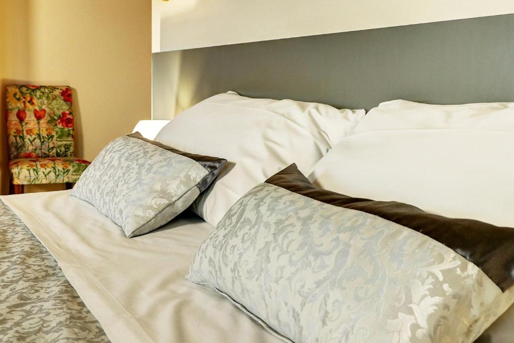Postel nebo postele na pokoji v ubytování B&B Le Noci di Feo