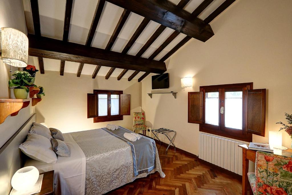 Postel nebo postele na pokoji v ubytování B&B Le Noci di Feo