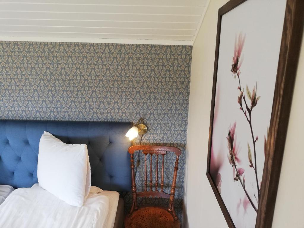 Postel nebo postele na pokoji v ubytování Karlsberg Gård B&B