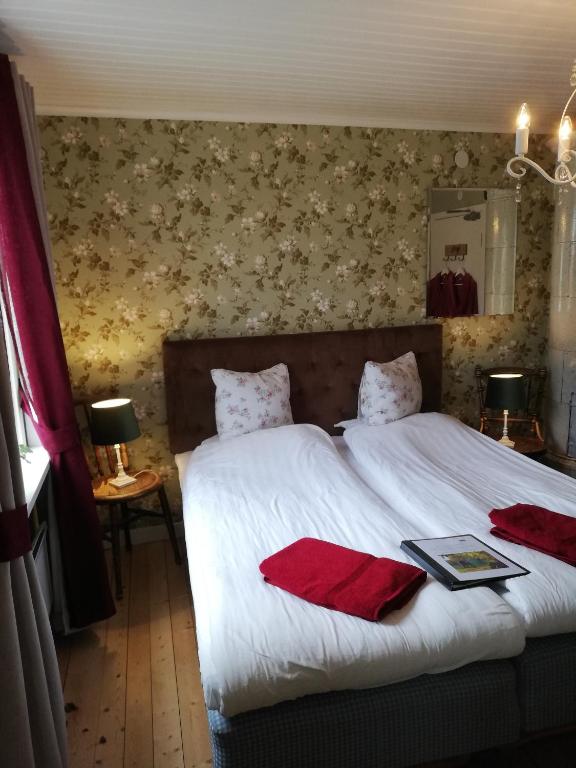 Postel nebo postele na pokoji v ubytování Karlsberg Gård B&B
