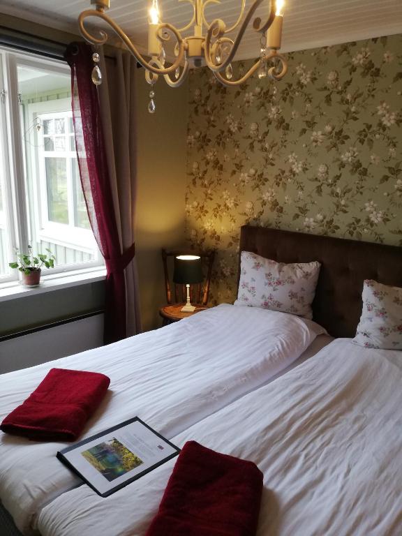 Postel nebo postele na pokoji v ubytování Karlsberg Gård B&B