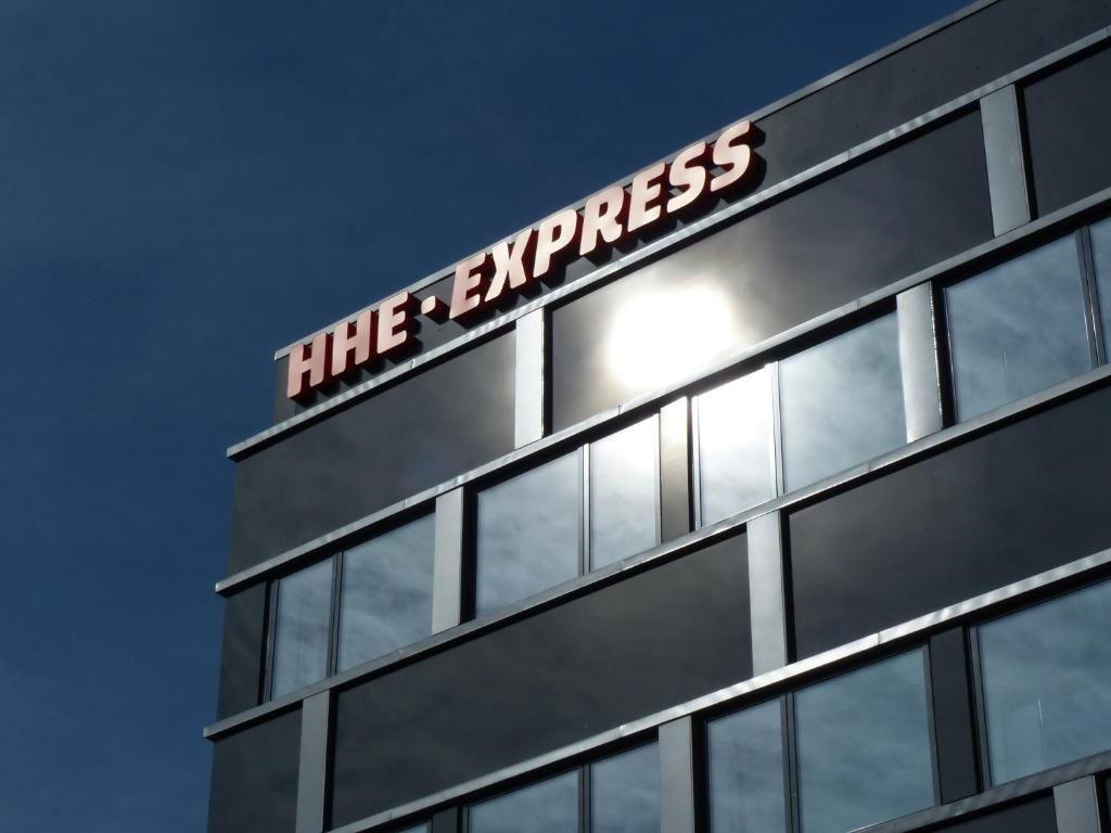 a building with a sign on the top of it at HHE Express in Nuuk