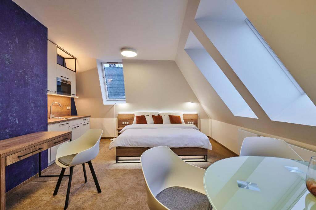 Postel nebo postele na pokoji v ubytování Hotel Alfréd a Hermína