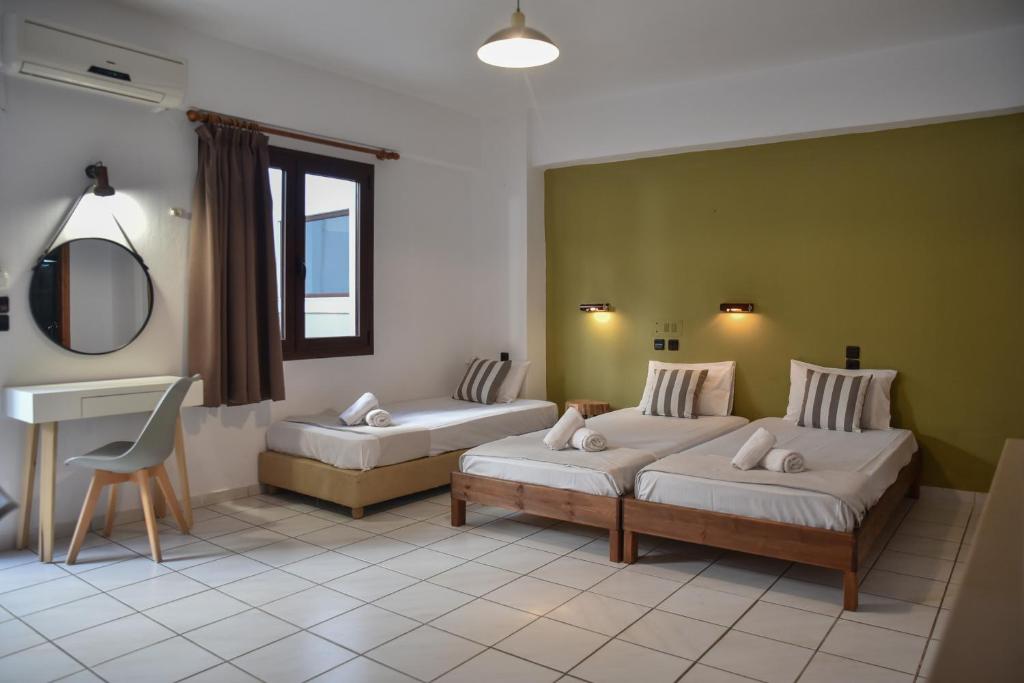 Postel nebo postele na pokoji v ubytování Iraklis Apartments