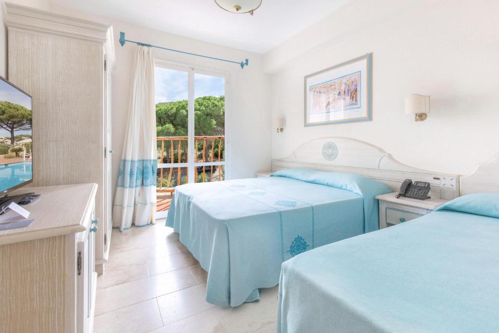 Posteľ alebo postele v izbe v ubytovaní Club Hotel Cormorano