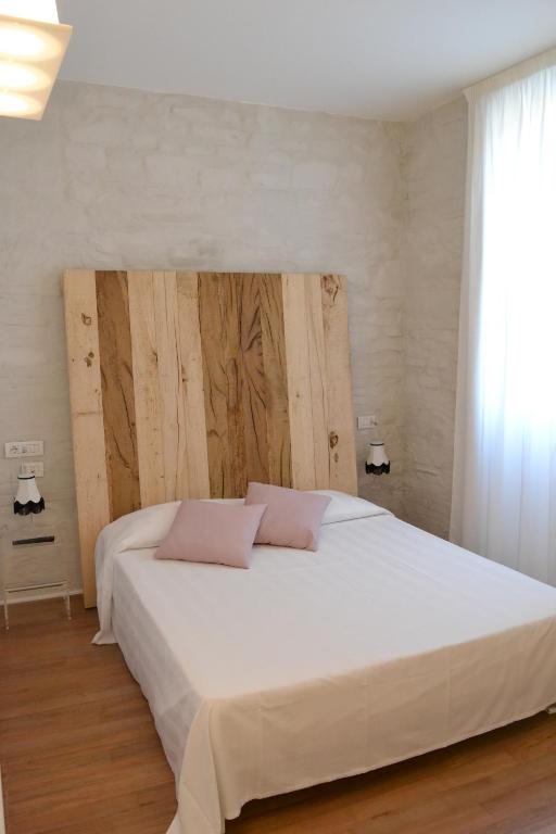 Postel nebo postele na pokoji v ubytování Albergo Il Rientro