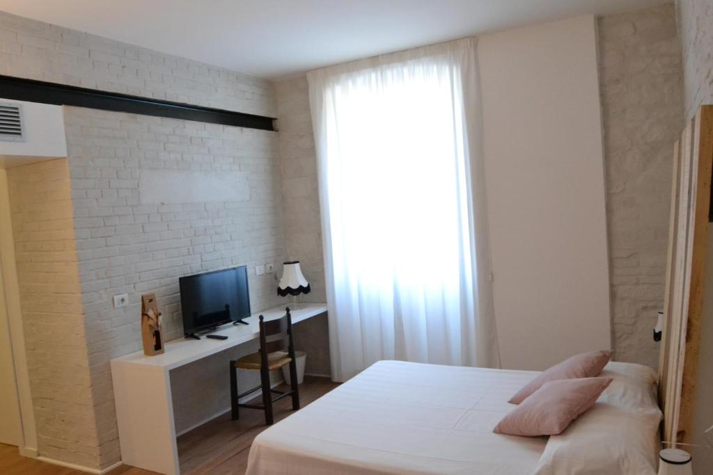 Postel nebo postele na pokoji v ubytování Albergo Il Rientro
