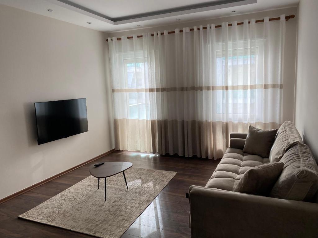 Et tv og/eller underholdning på Olea Seaside Apartment