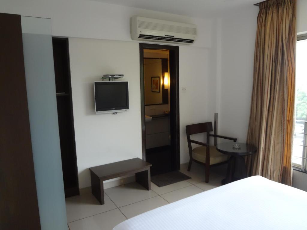 Postel nebo postele na pokoji v ubytování Shantai Hotel