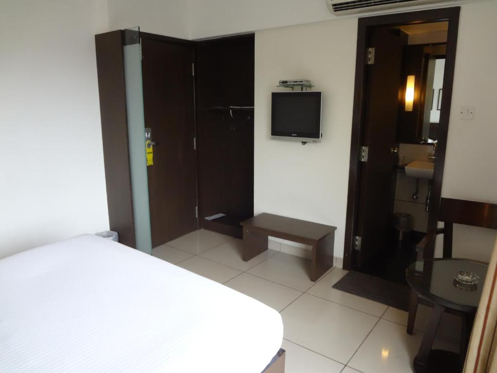 Postel nebo postele na pokoji v ubytování Shantai Hotel