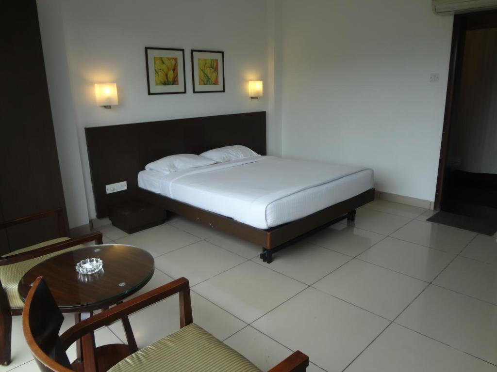 Postel nebo postele na pokoji v ubytování Shantai Hotel