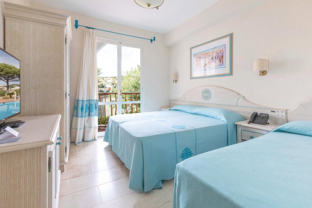 Posteľ alebo postele v izbe v ubytovaní Club Hotel Cormorano