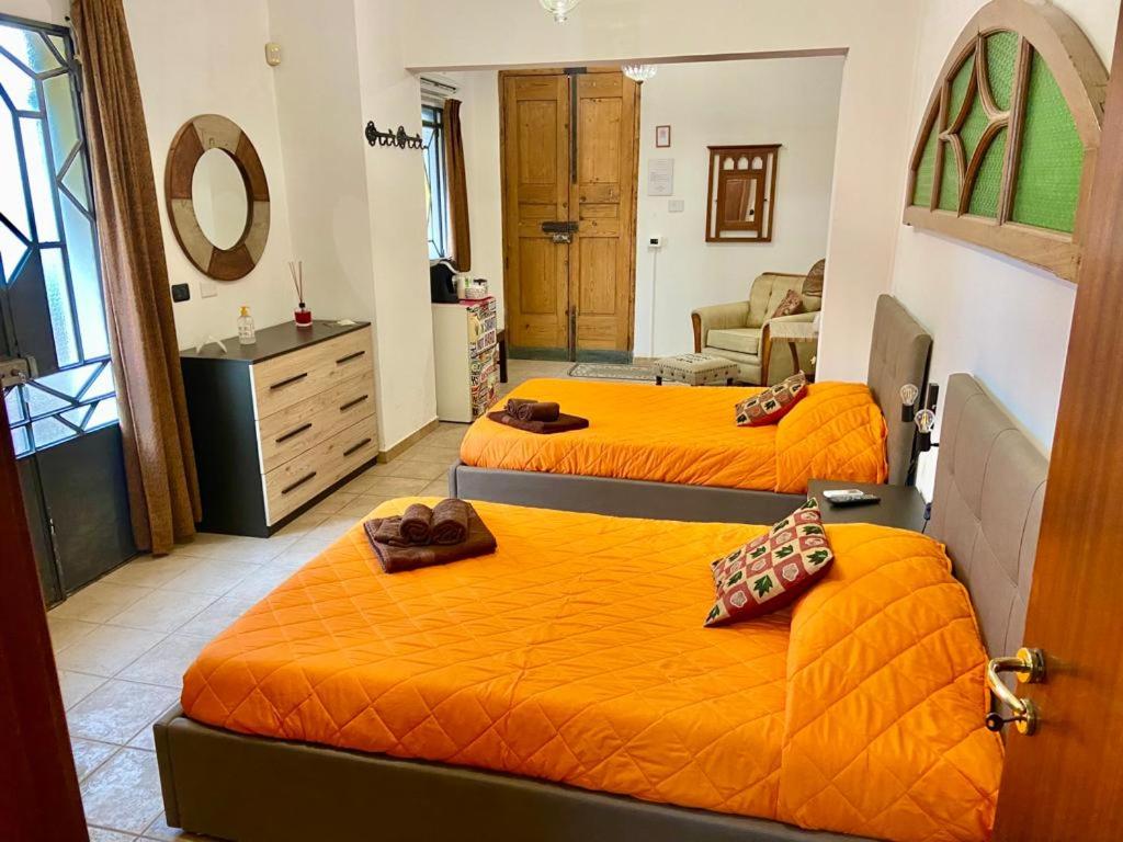 Łóżko lub łóżka w pokoju w obiekcie Casa di Marco