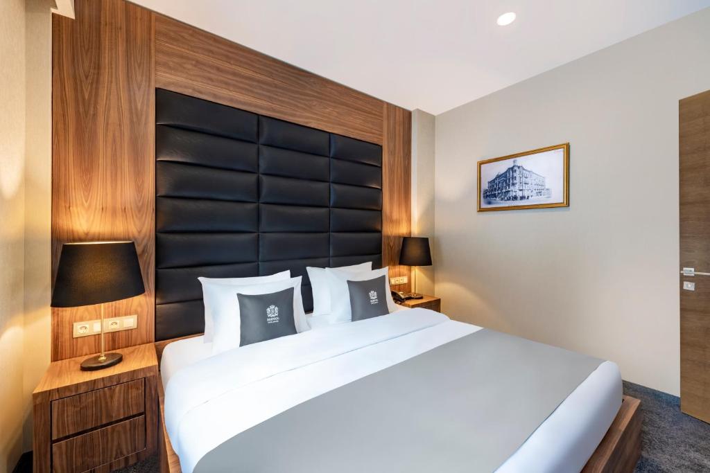 Letto o letti in una camera di Bristol Hotel and Spa Bakuriani