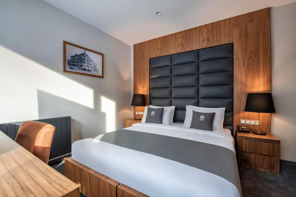 Letto o letti in una camera di Bristol Hotel and Spa Bakuriani